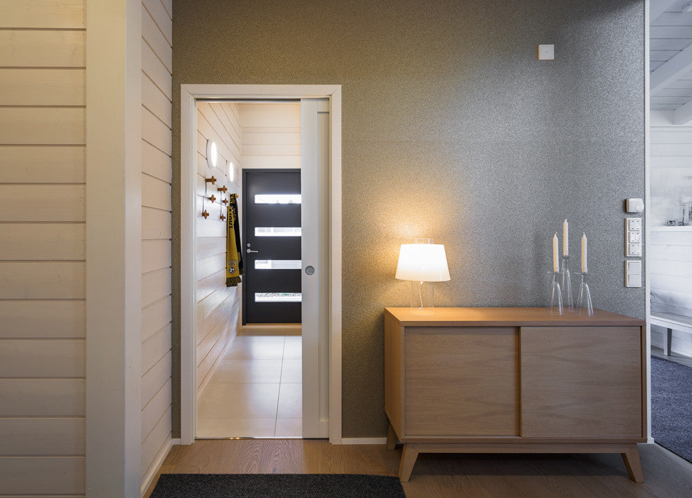 The ECLISSE sliding pocket door system is an elegant, practical alternative to conventional hinged doors and can be used throughout the house. Here the ECLISSE pocket door is connecting a hallway or corridor to a living area.